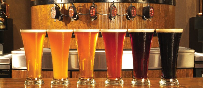A photo of a line of beer at Rockbottom Brewpub for Good Cheer Trail travel blog