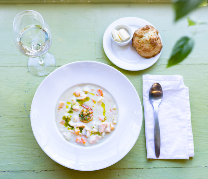 flying apron chowder with biscuit and wine