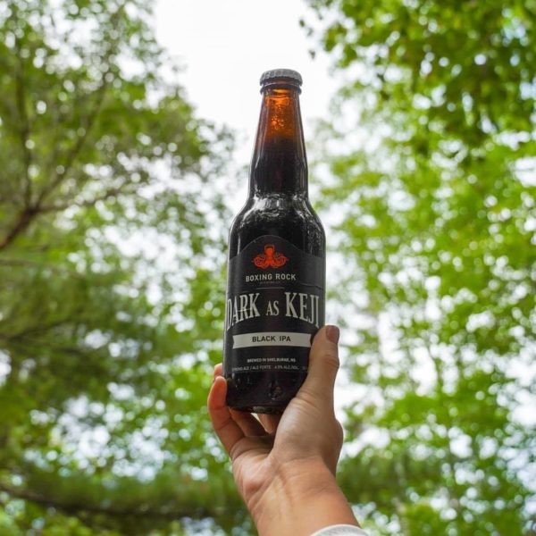 boxing rock beer in woods