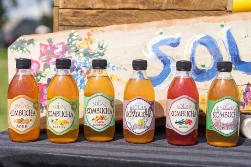 Six flavours of solas kombucha in a line