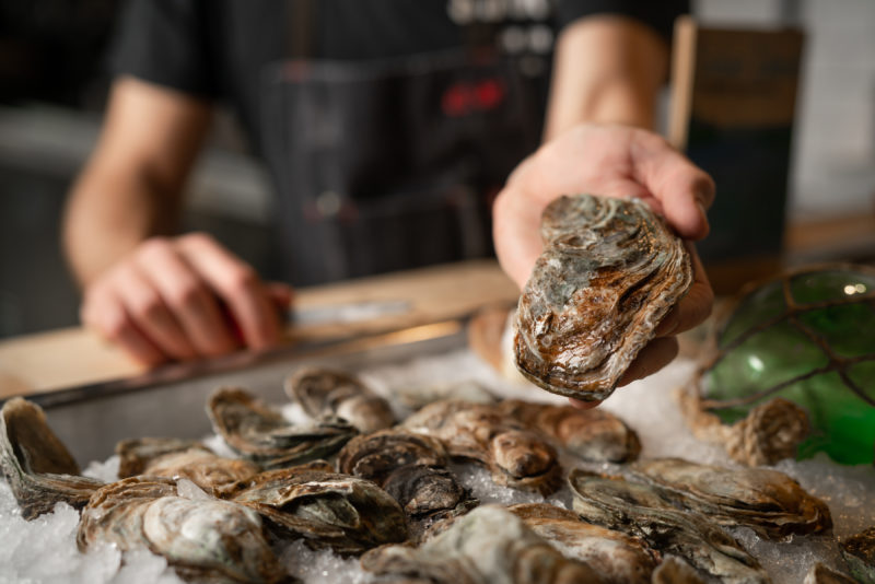 Hand on Local Oysters