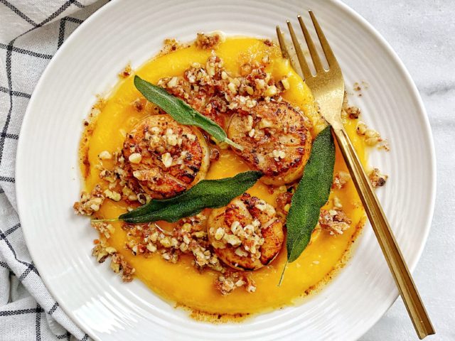scallops with puree on a white plate