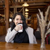 a person drinks a coffee at the Barn