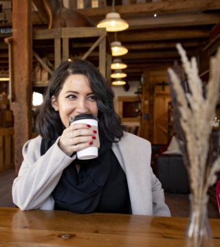 a person drinks a coffee at the Barn