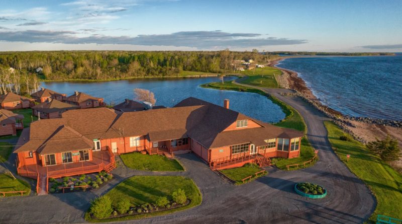 Aerial shot of Pictou Lodge with ocean in background