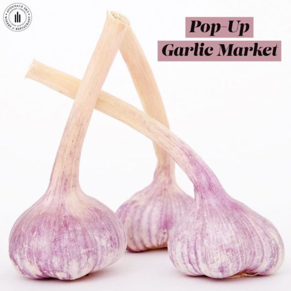 three garlic bulbs with the words pop up garlic market