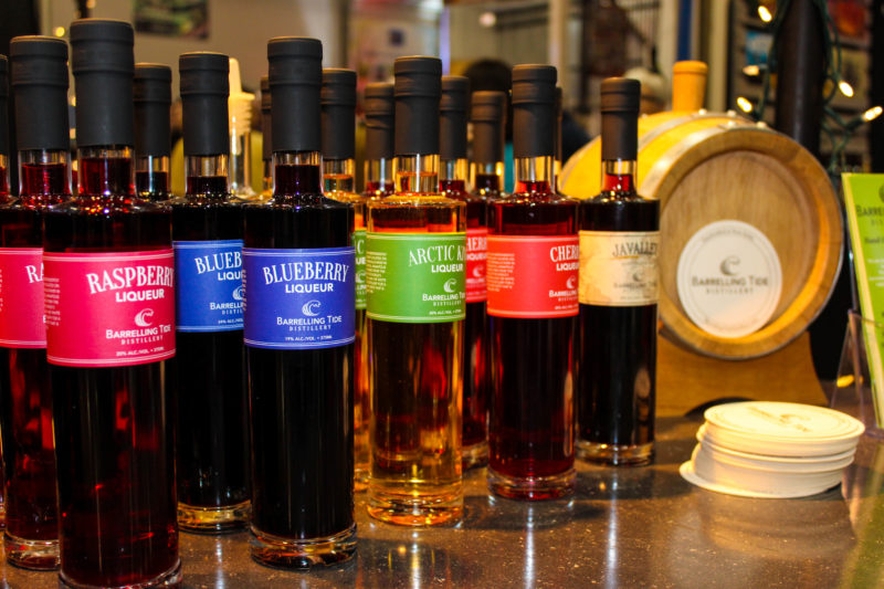 bottles of barrelling tide distillery liqueur lined up at saltscapes
