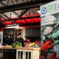 the kilted chef stands on the taste of nova scotia stage at saltscapes