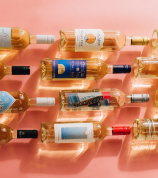 12 tidal bay wine bottles on a pink background
