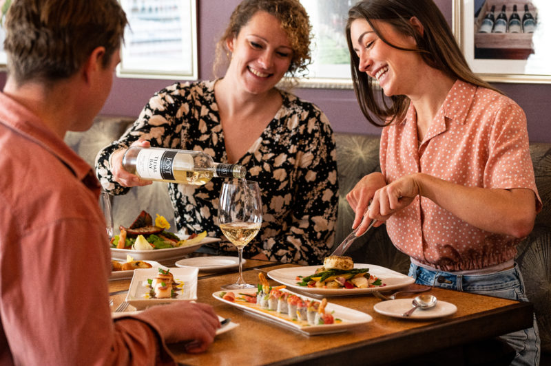 People enjoying food and wine at Gabrieau's Bistro. 