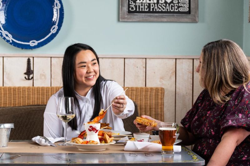 two people eating at a table at capt kat's