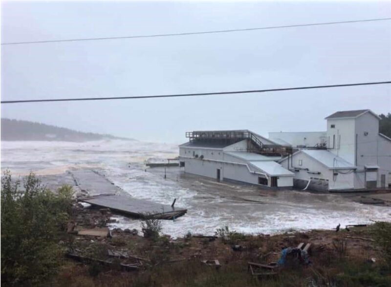 A photo of the exterior of Victoria Co-Operative Fisheries Ltd showing flood waters from Hurricane Fiona