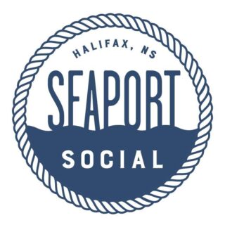 A photo of the Seaport Social logo. The logo shows a round rope circle, with the word Seaport sitting on top of a wave of water and the word Social within the water.